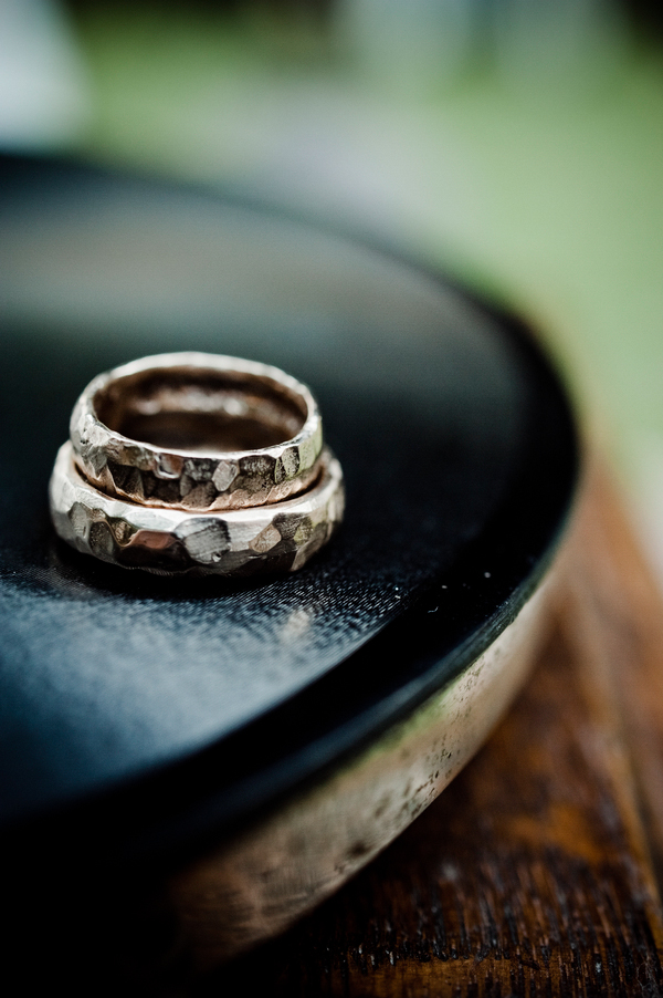wood inspired rings rest on a record - music inspired DIY wedding - photos by top Orange County, CA wedding photographers Viera Photographics